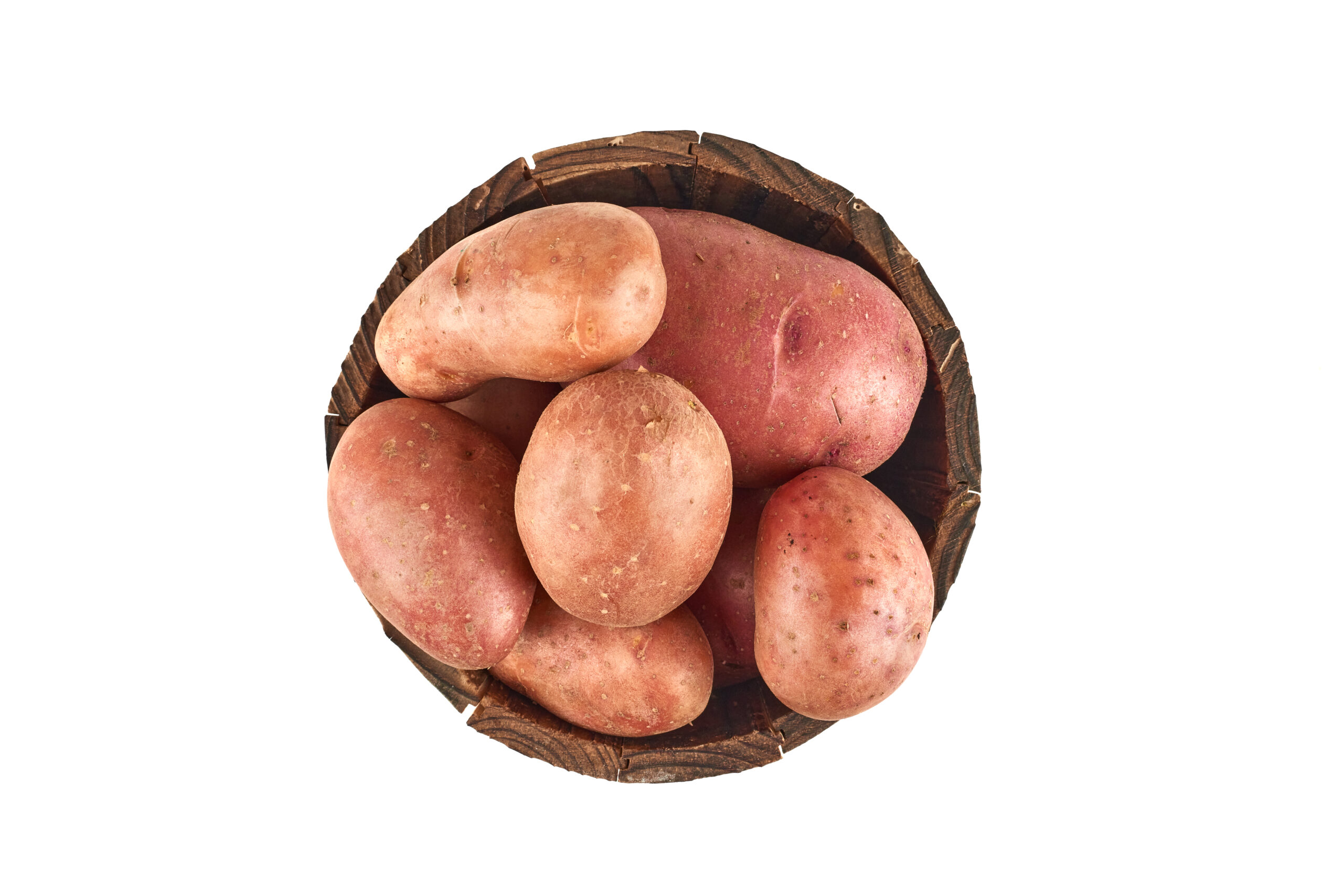 Potatoes in a wooden bucket . High quality photo